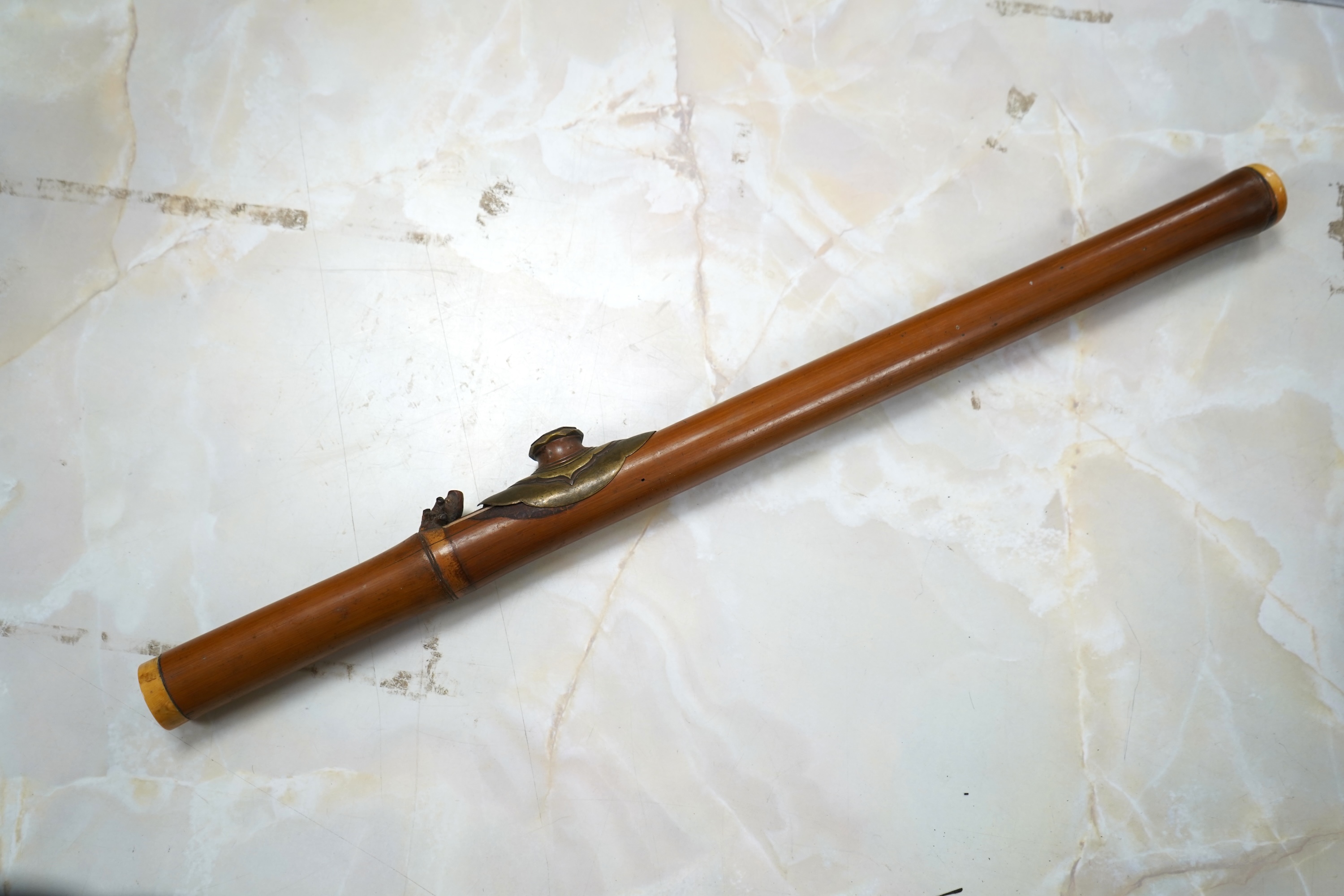 A 19th century bamboo and ivory mounted opium pipe, 58cm in length CITES Submission reference 7T1VK7KR
